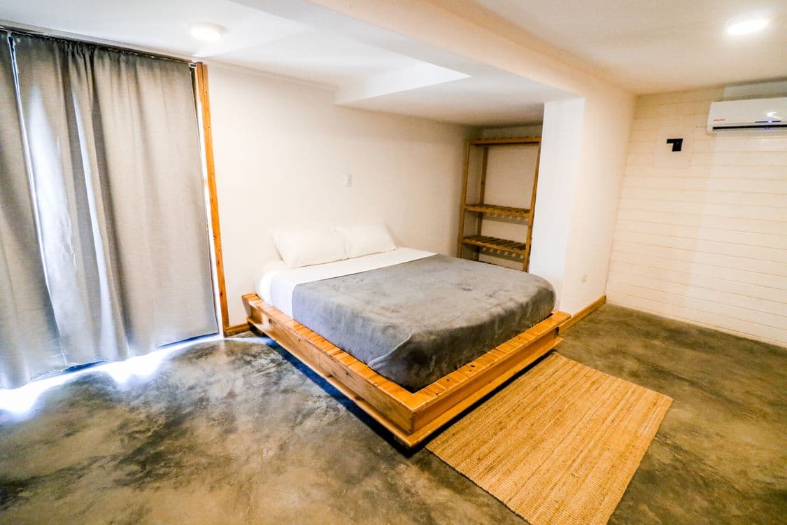Minimalist bedroom with wooden bed frame