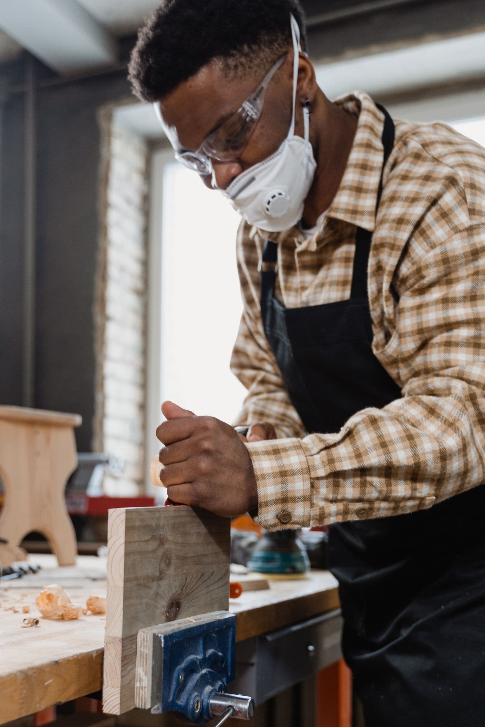 Skilled craftsman restoring wooden furniture